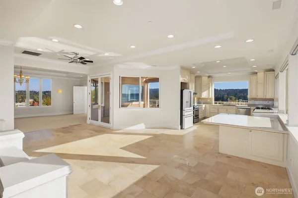 en empty room with windows and outdoor view