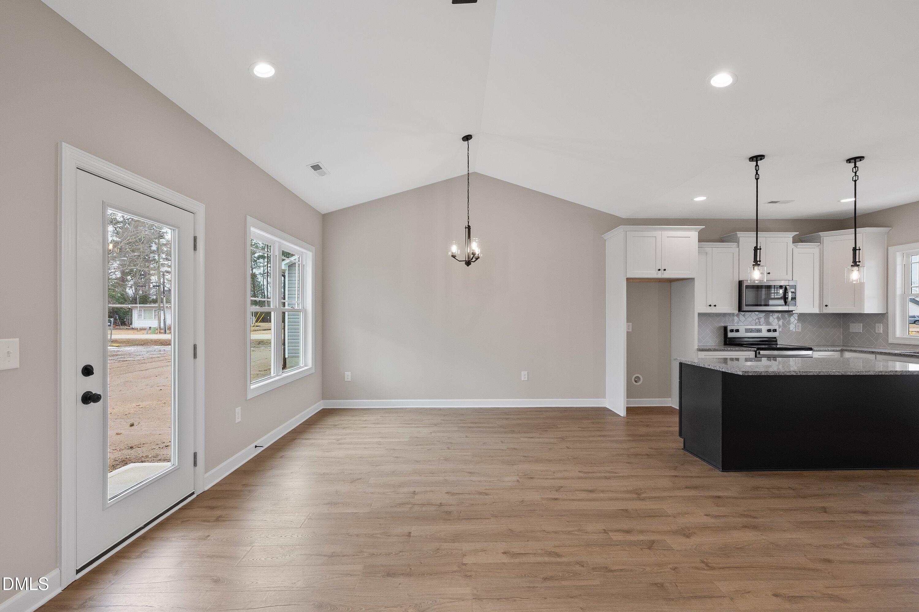 922 Micro Road West Selma, NC 27576 - Photo 20 of 36 a view of kitchen with refrigerator and window