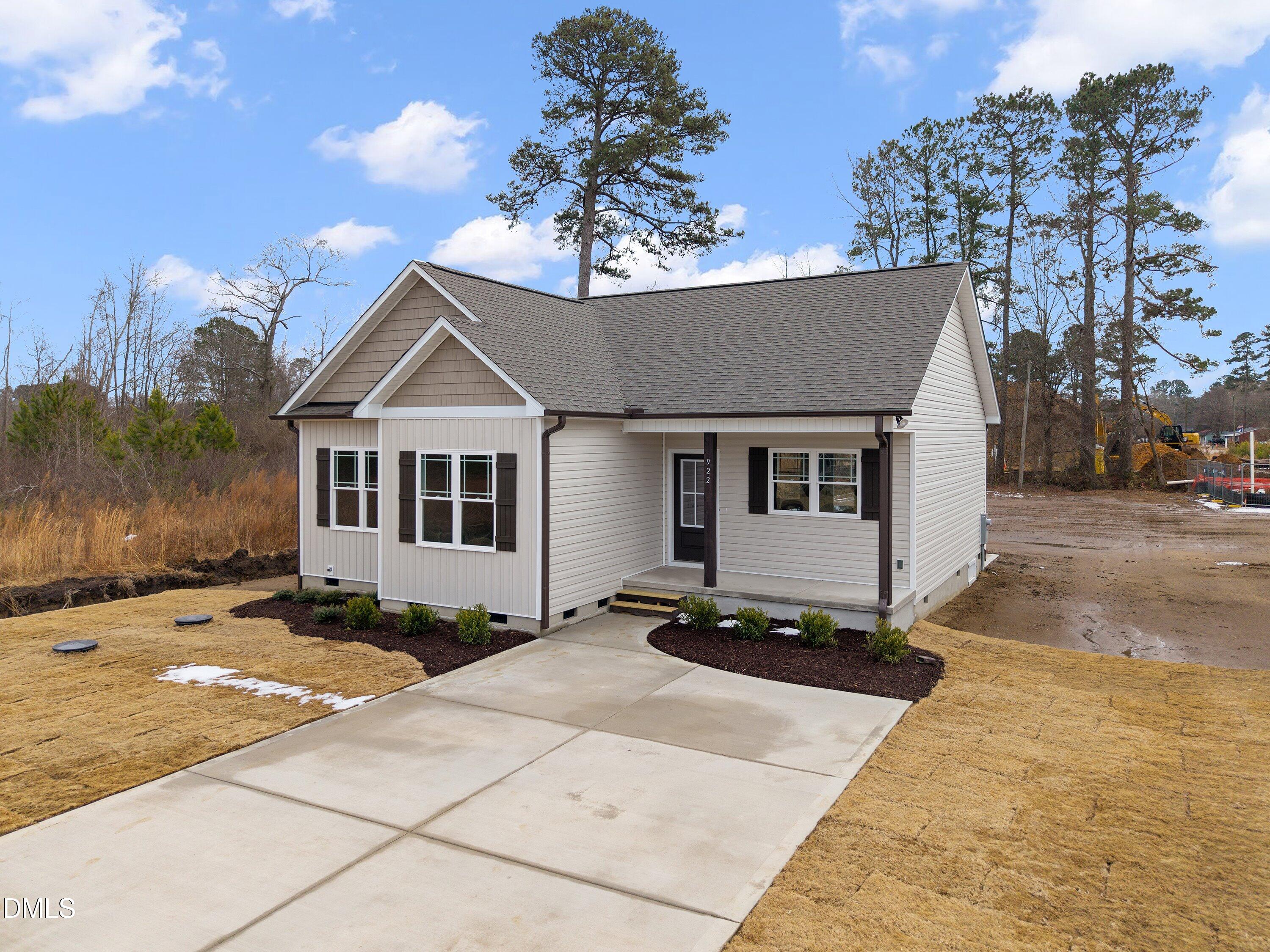922 Micro Road West Selma, NC 27576 - Photo 2 of 36 a front view of a house with a yard