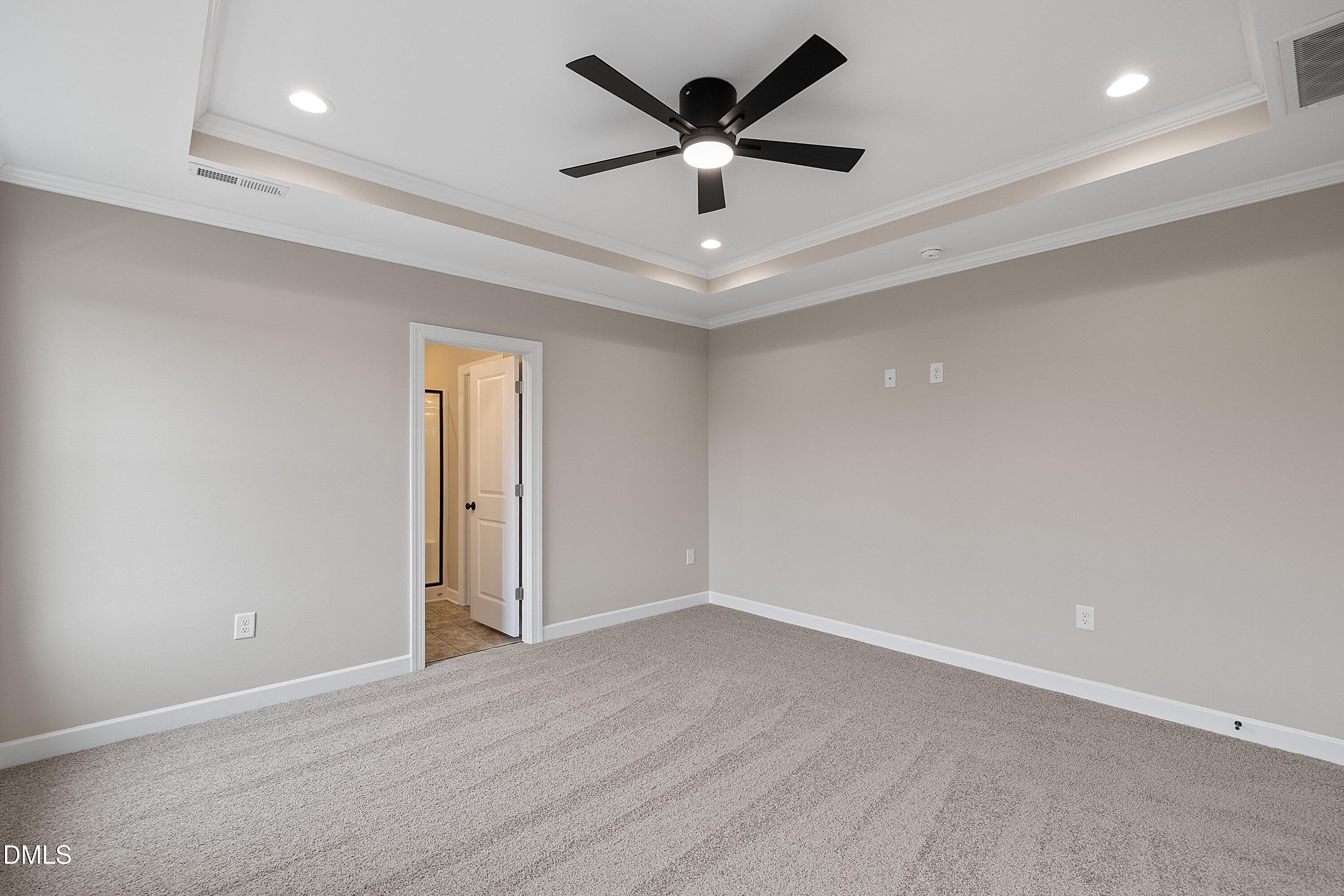 922 Micro Road West Selma, NC 27576 - Photo 22 of 36 an empty room with ceiling fan and window