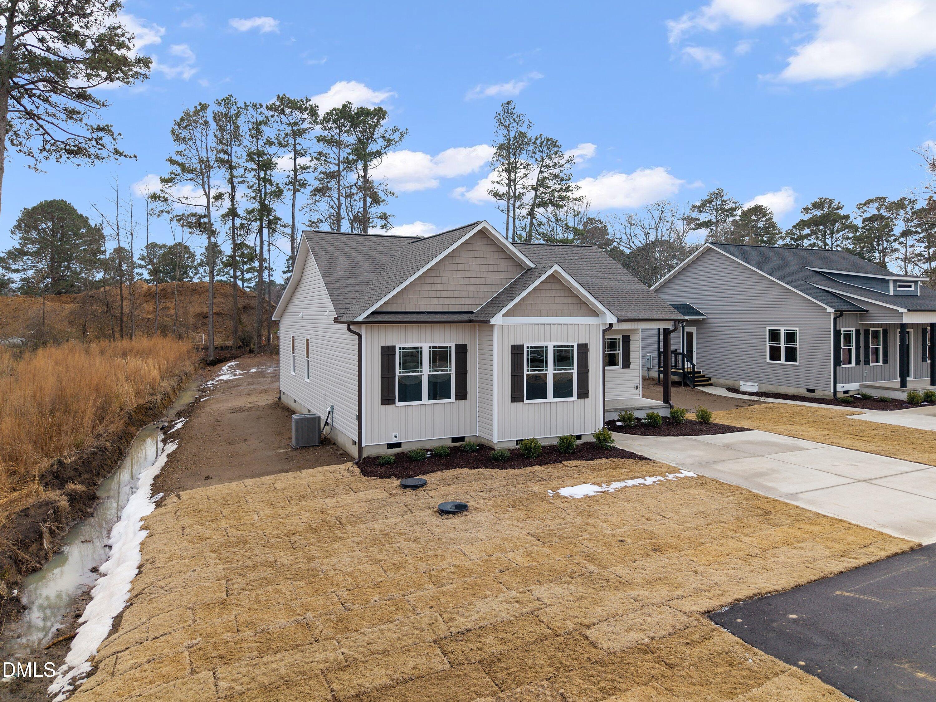 922 Micro Road West Selma, NC 27576 - Photo 3 of 36 a front view of a house with a yard