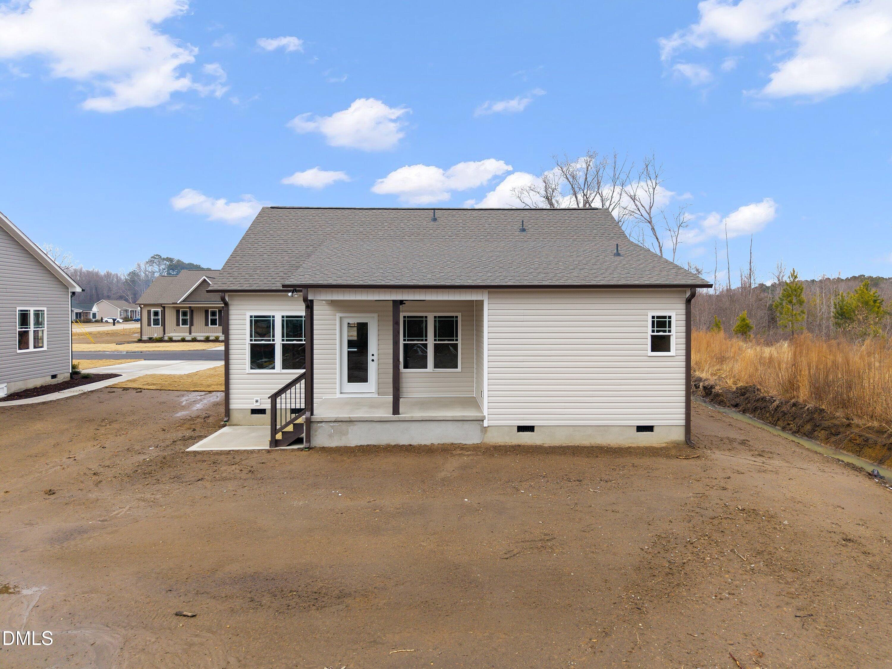 922 Micro Road West Selma, NC 27576 - Photo 35 of 36 a view of a house with backyard and parking area