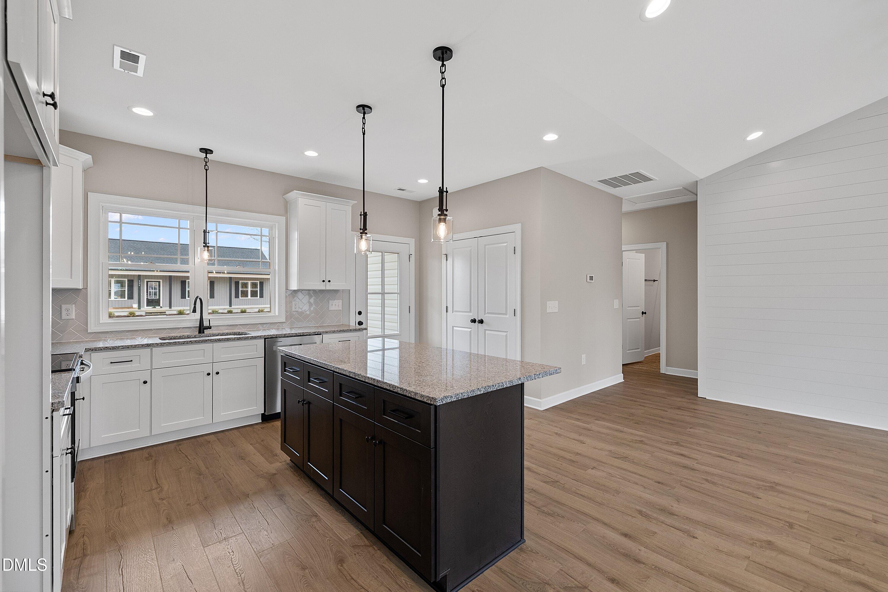 922 Micro Road West Selma, NC 27576 - Photo 7 of 36 a kitchen with a refrigerator sink and cabinets