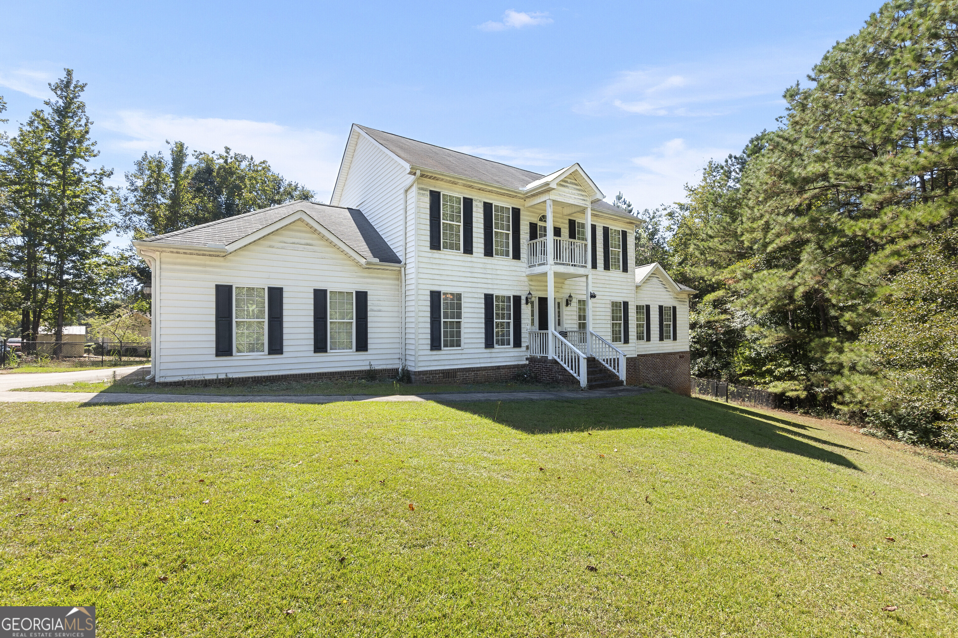 a front view of a house with swimming pool