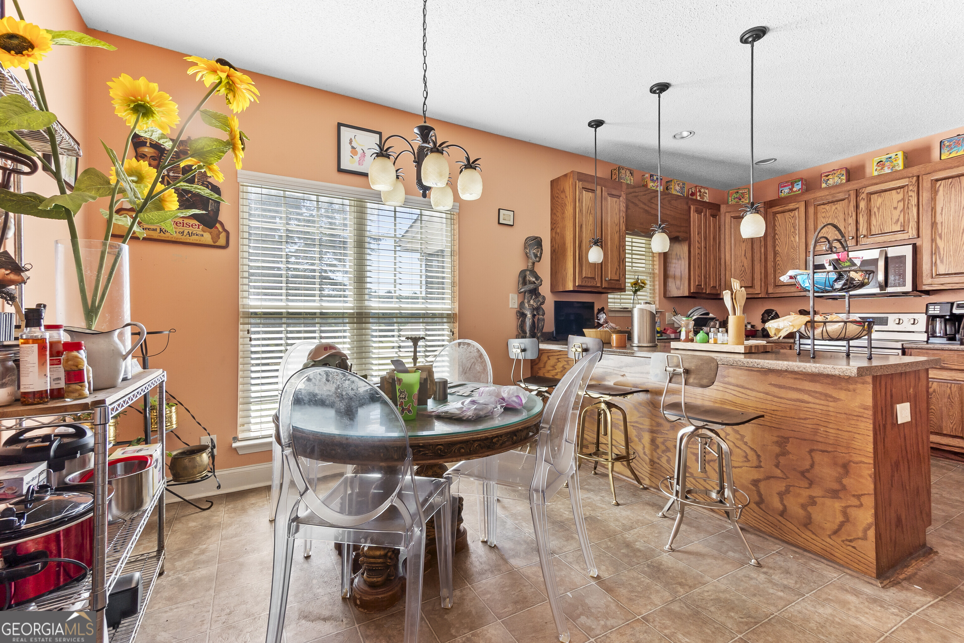 3608 Joycliff Road Macon, GA 31211 - Photo 12 of 44 a living room with furniture and a chandelier