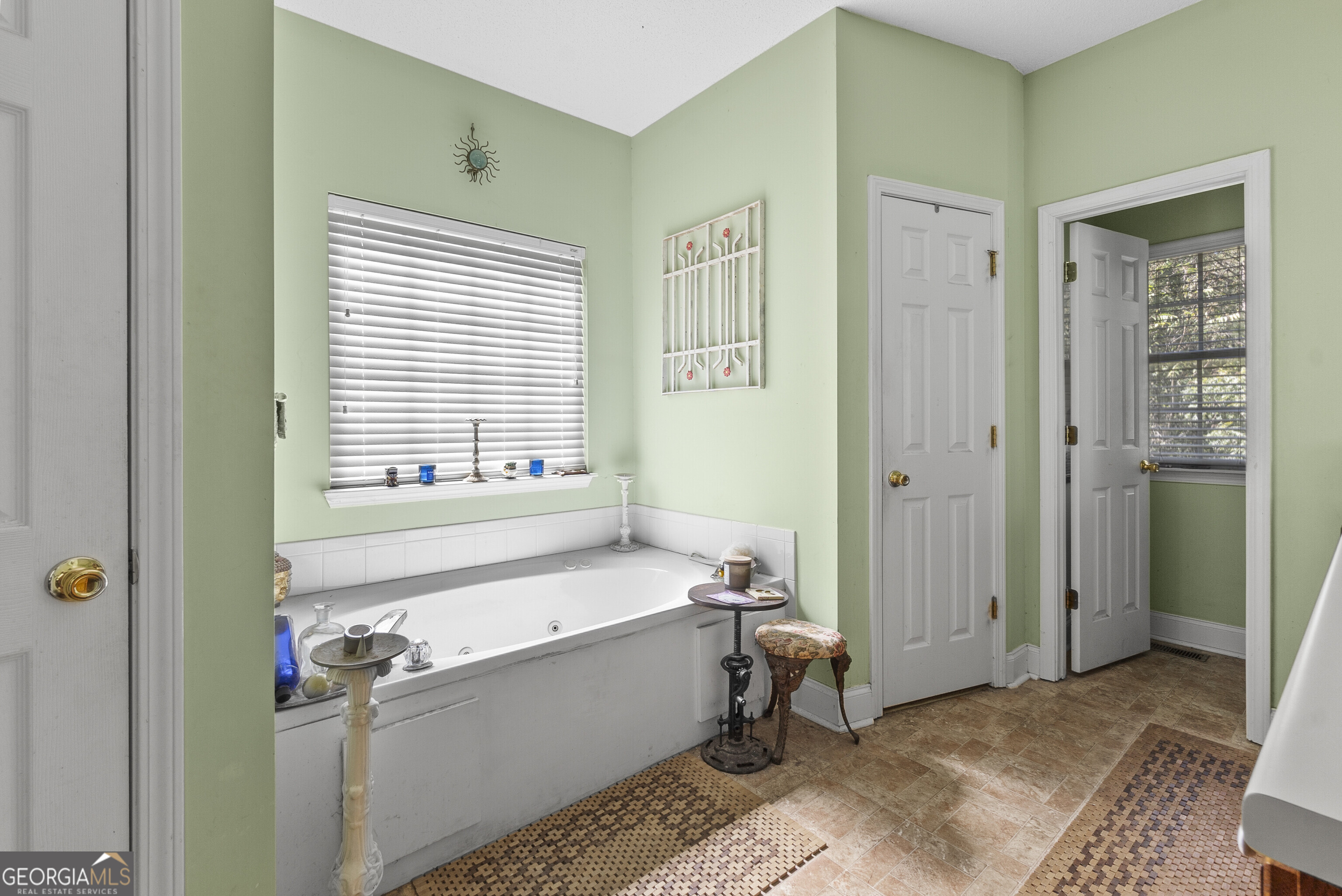 3608 Joycliff Road Macon, GA 31211 - Photo 21 of 44 a bathroom with a bathtub and a sink