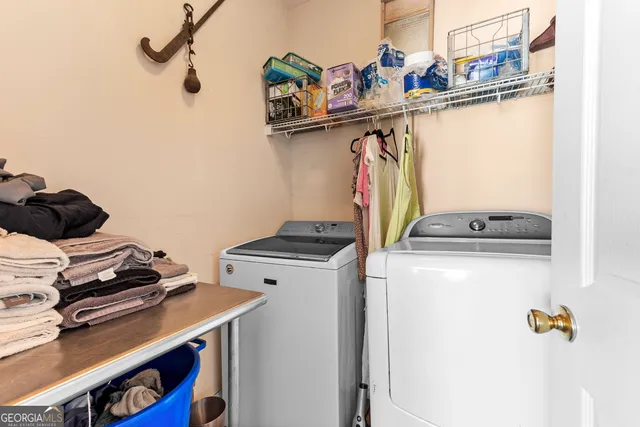 a utility room with dryer and washer