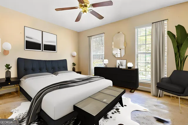 a bedroom with a bed and wooden floor