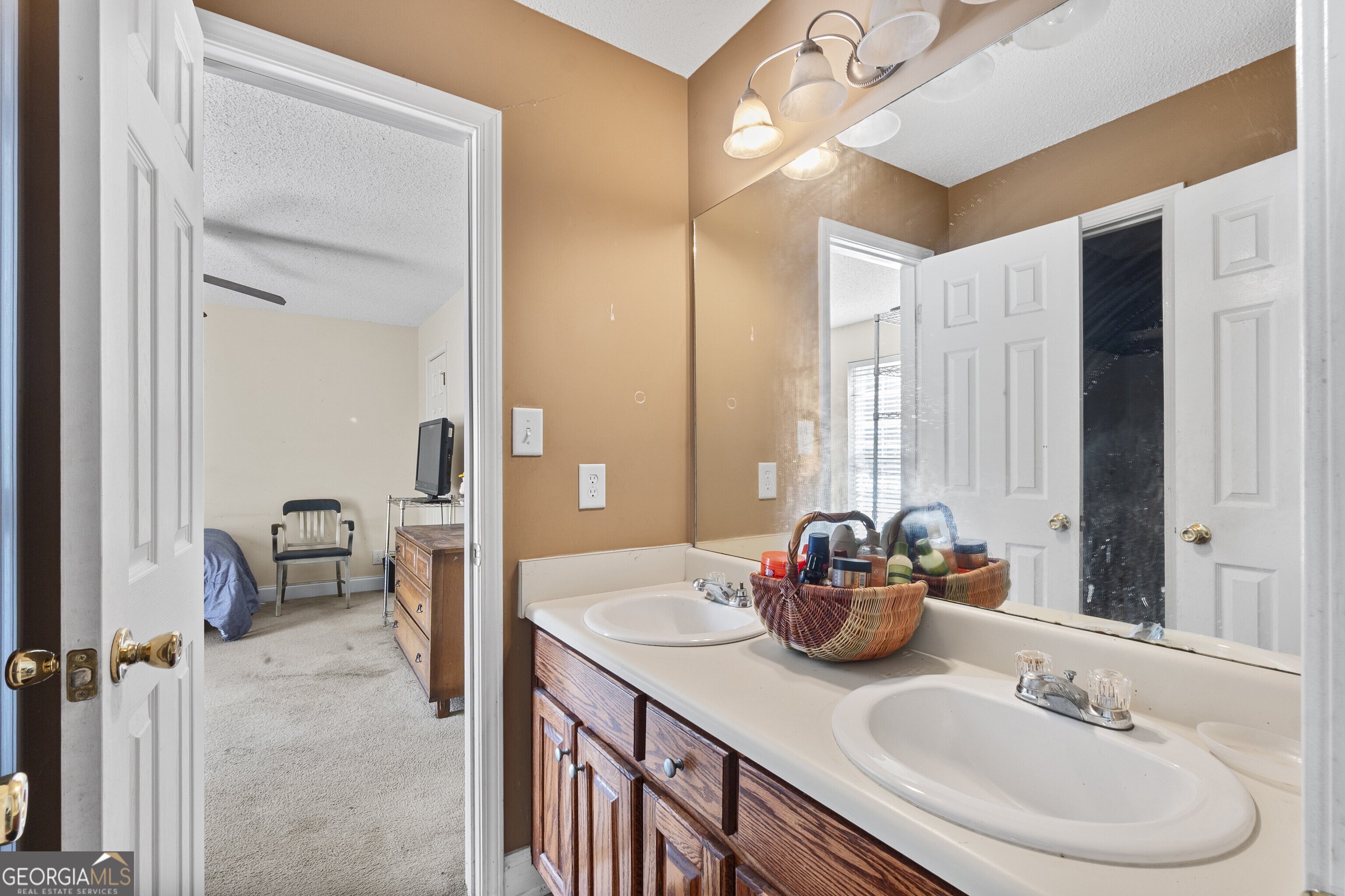 3608 Joycliff Road Macon, GA 31211 - Photo 35 of 44 a bathroom with a sink double vanity and a mirror