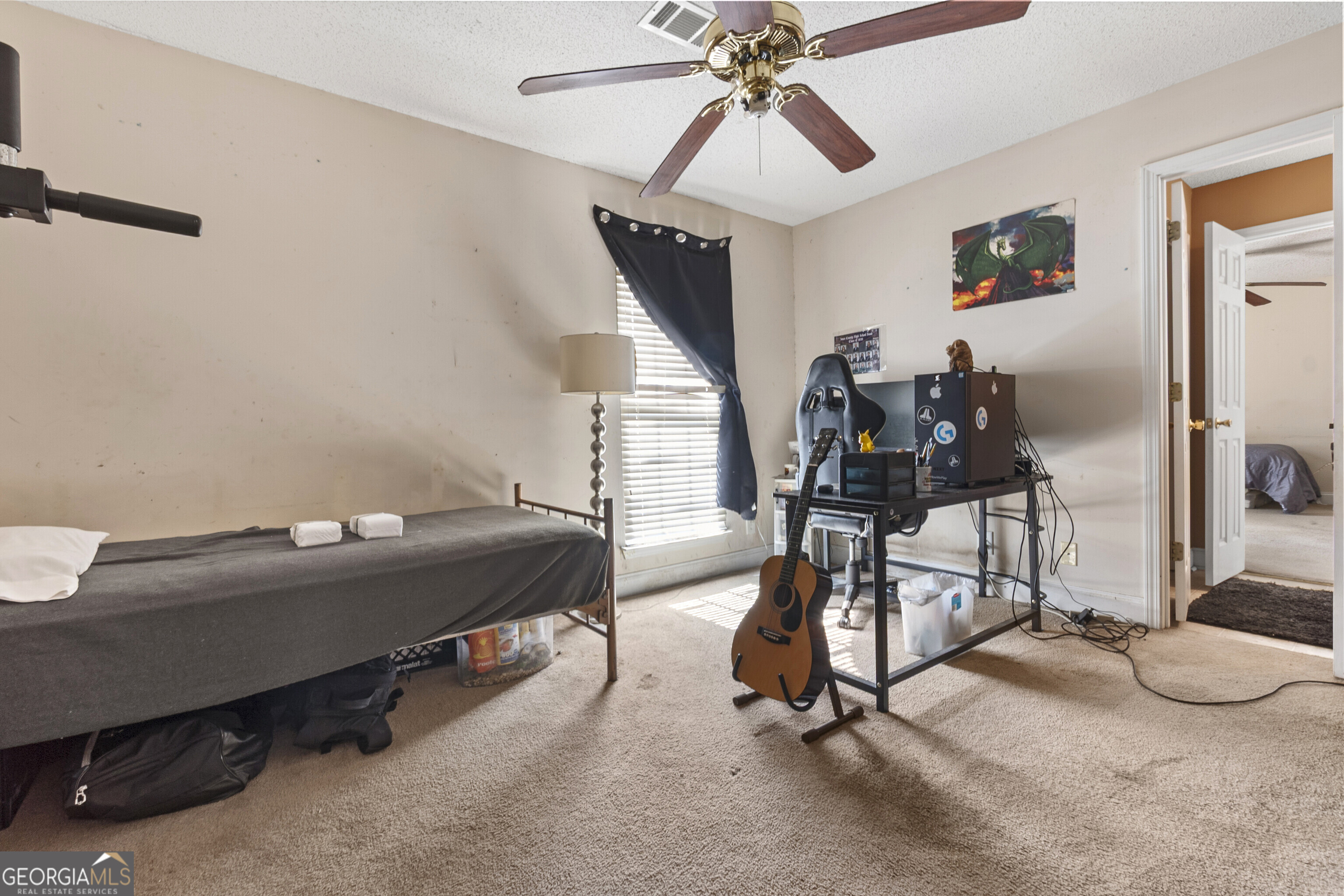 3608 Joycliff Road Macon, GA 31211 - Photo 36 of 44 a room with gym equipment and a large mirror