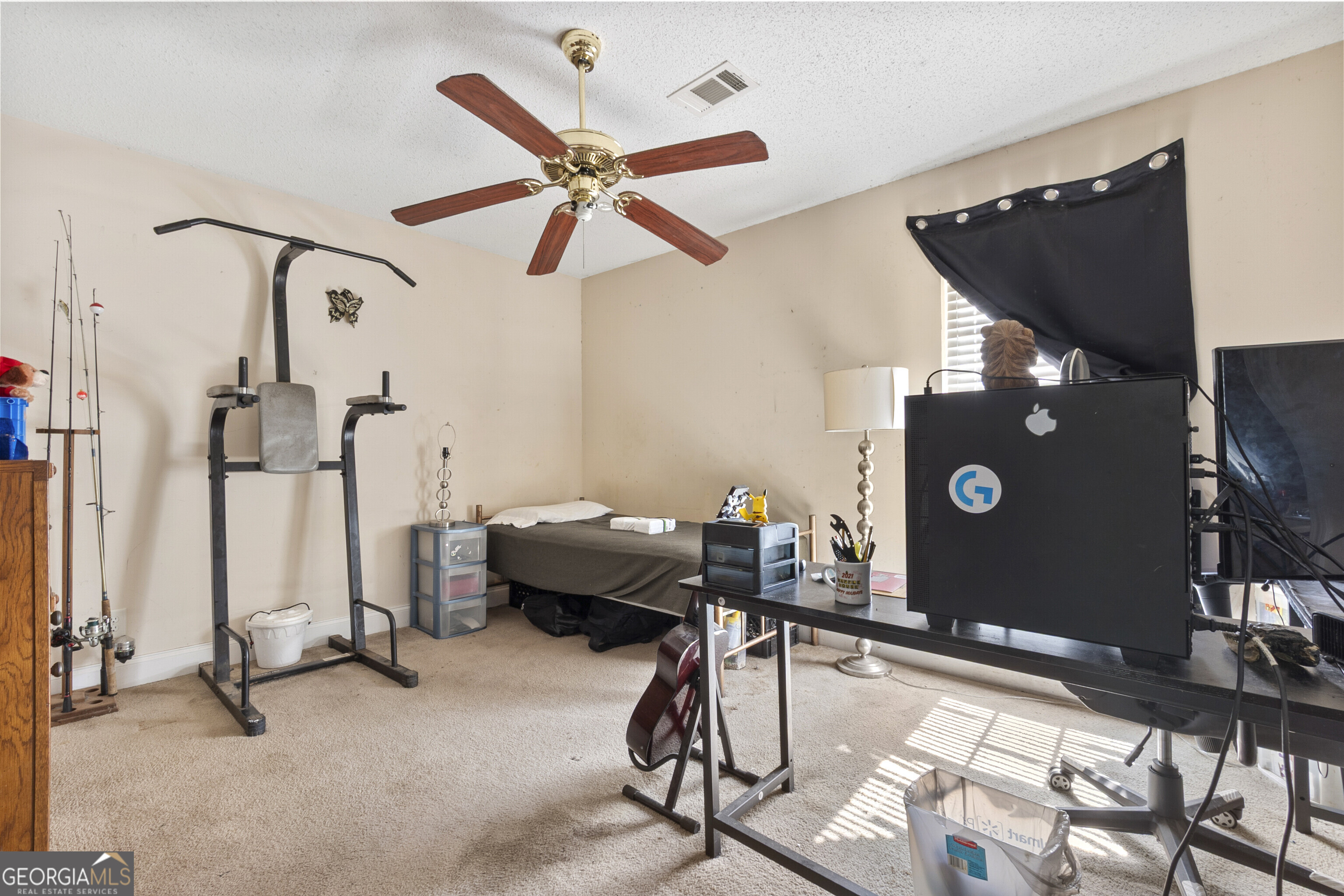 3608 Joycliff Road Macon, GA 31211 - Photo 37 of 44 a living room with furniture and a flat screen tv