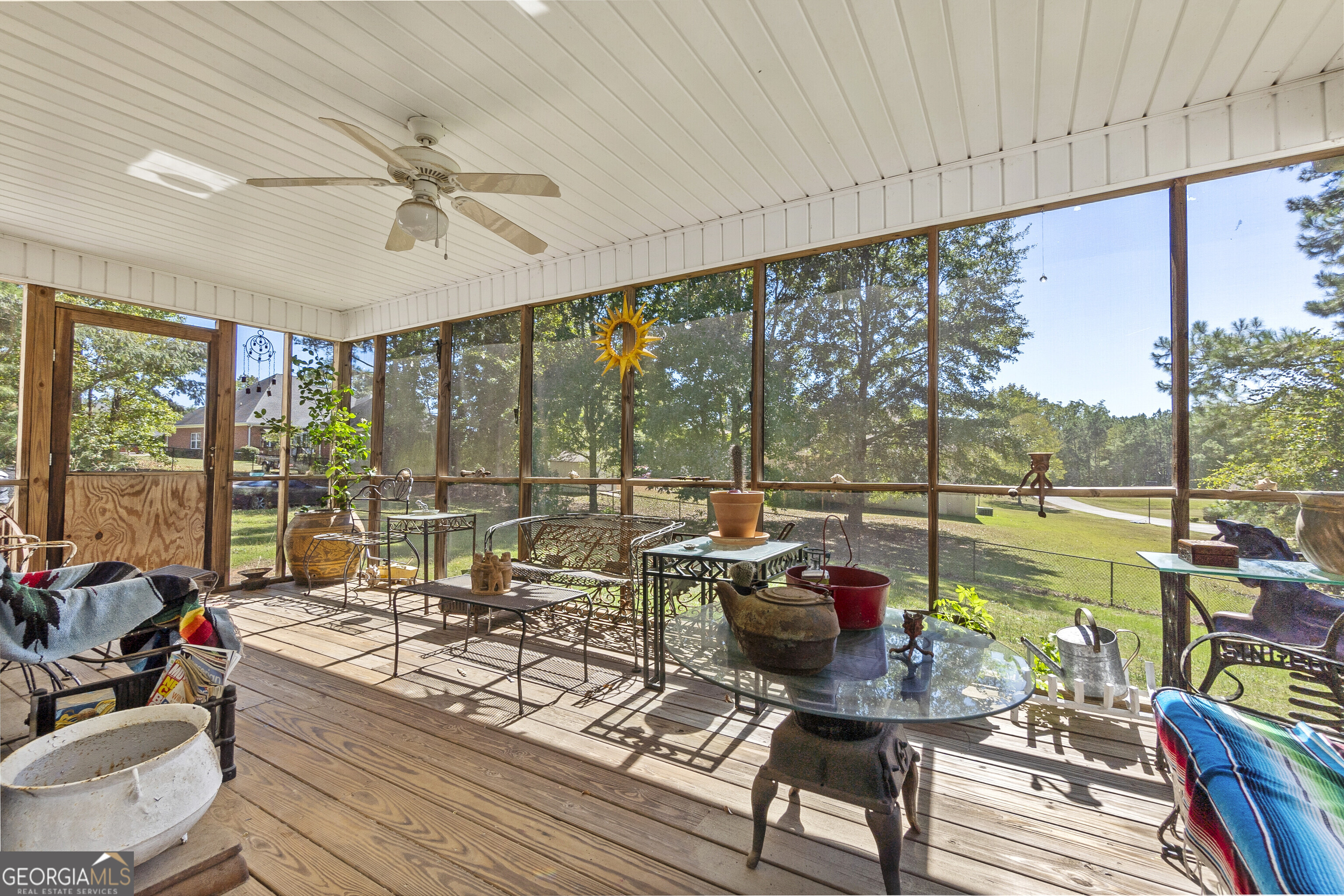3608 Joycliff Road Macon, GA 31211 - Photo 38 of 44 a living room with furniture and floor to ceiling windows