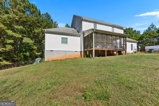 a view of house with yard