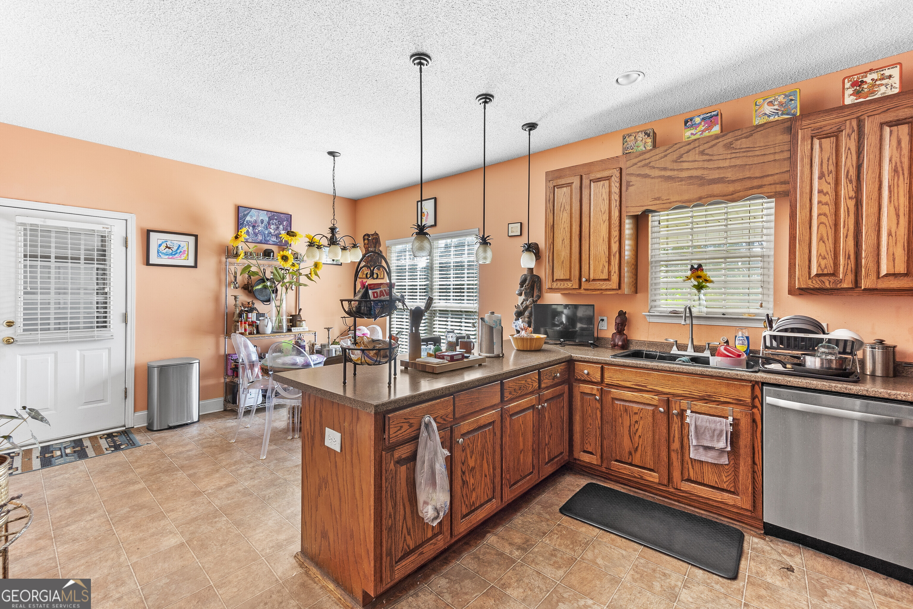3608 Joycliff Road Macon, GA 31211 - Photo 10 of 44 a kitchen with stainless steel appliances granite countertop a sink and cabinets