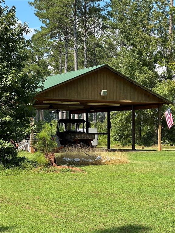 2470 Fears Road Madison, GA 30650 - Photo 26 of 48 a view of a house with backyard and sitting area