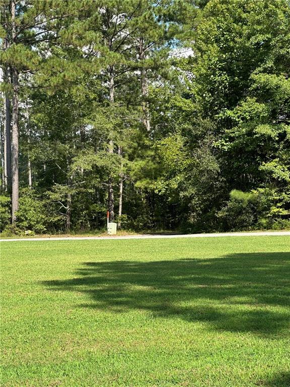 2470 Fears Road Madison, GA 30650 - Photo 27 of 48 a view of a golf course with a lake view