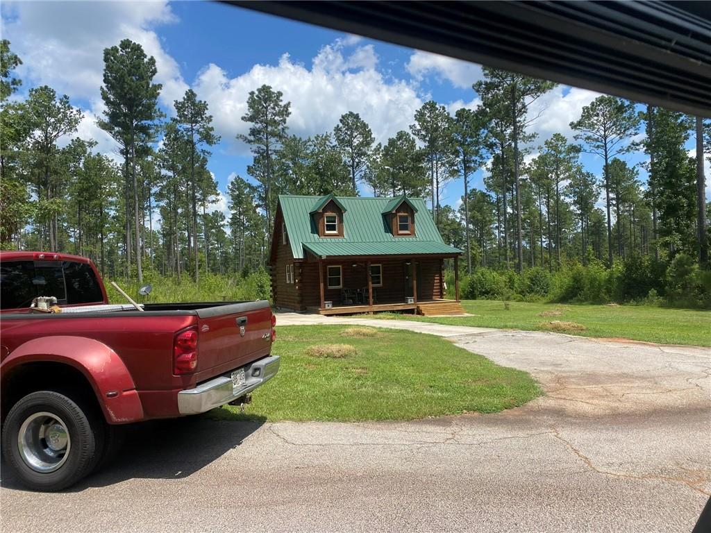 2470 Fears Road Madison, GA 30650 - Photo 30 of 48 a front view of a house with garden