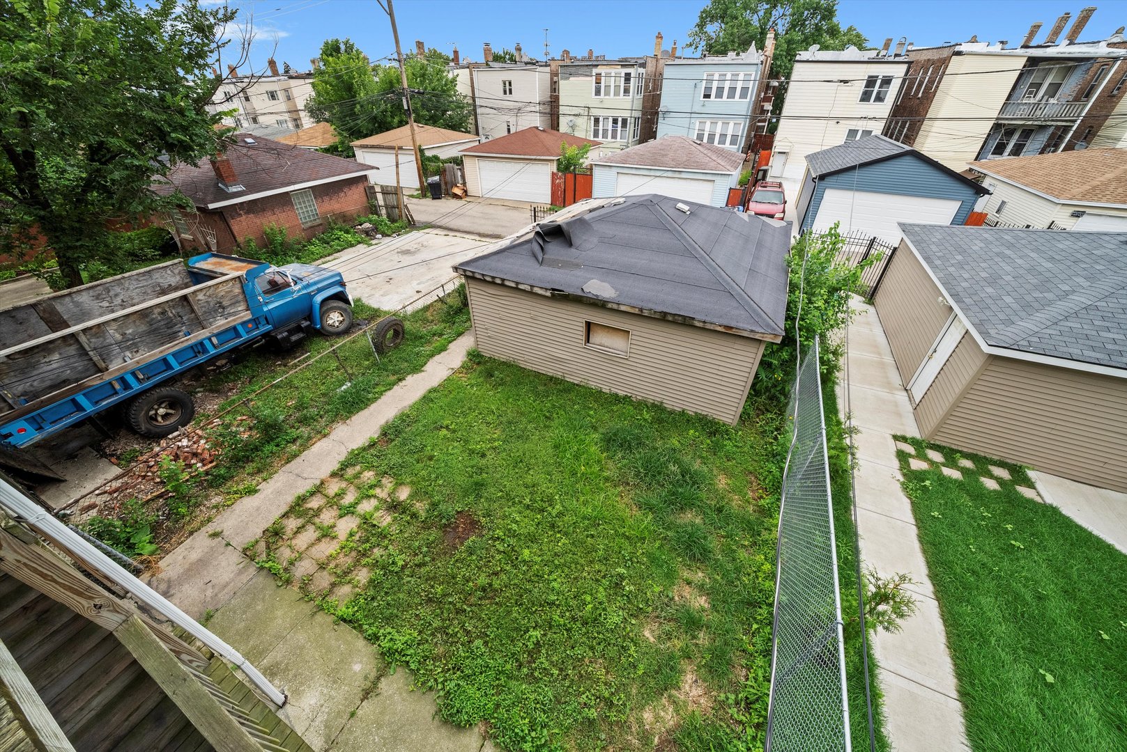 4318 West Cermak Road Chicago, IL 60623 - Photo 17 of 17 an aerial view of a house with garden space and street view
