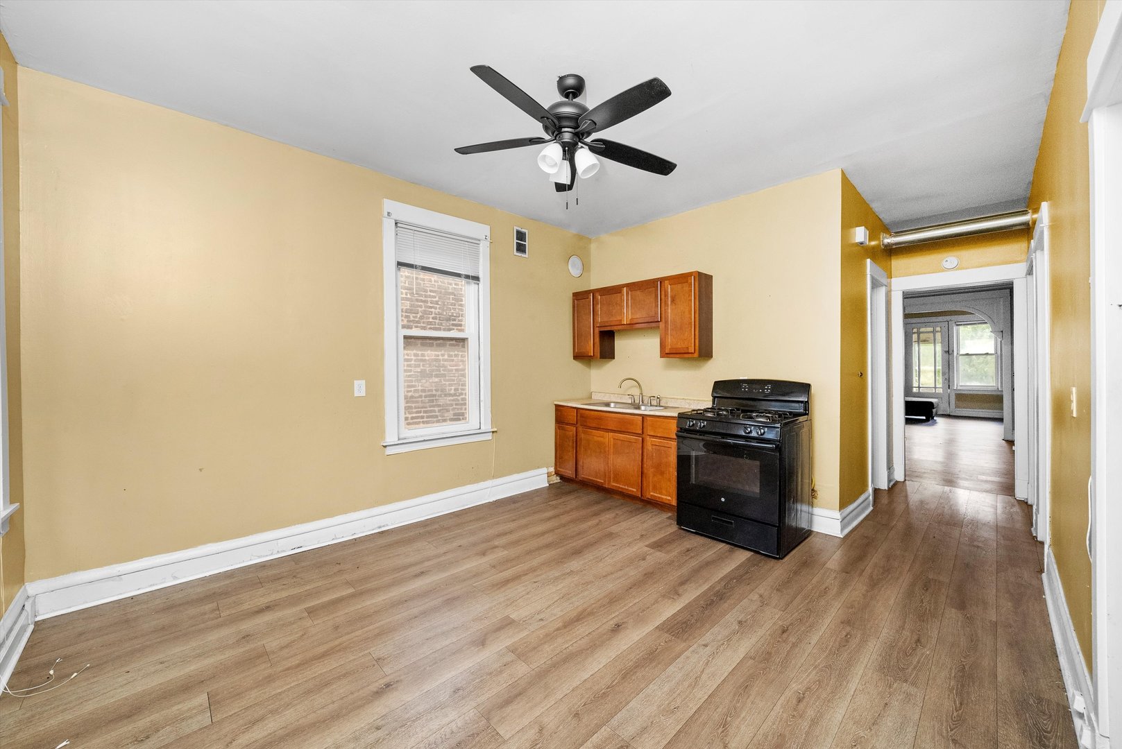 4318 West Cermak Road Chicago, IL 60623 - Photo 5 of 17 a living room with furniture and a window