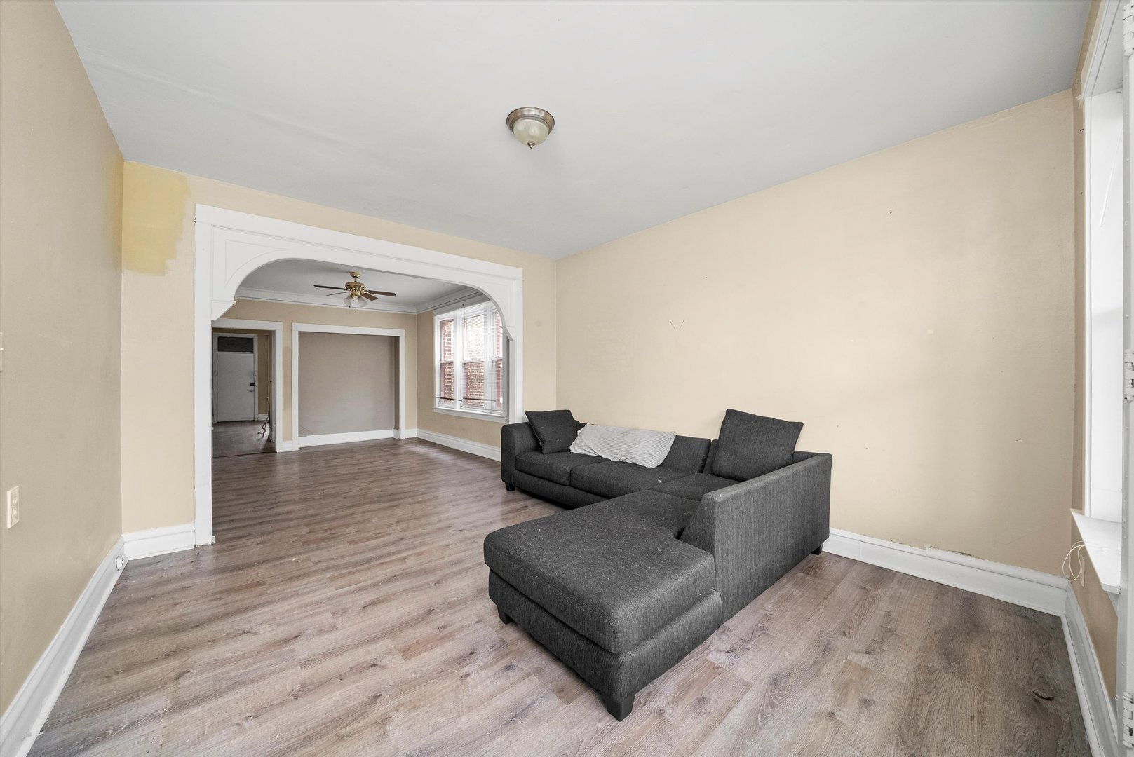 4318 West Cermak Road Chicago, IL 60623 - Photo 9 of 17 a living room with couches and a flat screen tv