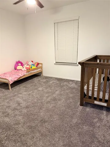 a room with toys and dresser