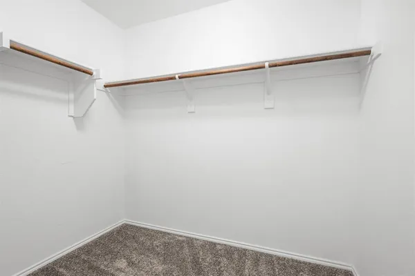 a view of a room with shelf on the wall
