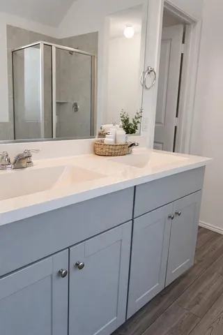 a bathroom with a sink and a mirror