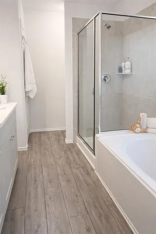 a bathroom with a bathtub and a shower