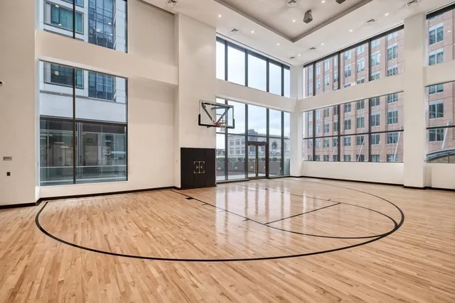 a living room filled with furniture and a floor to ceiling window