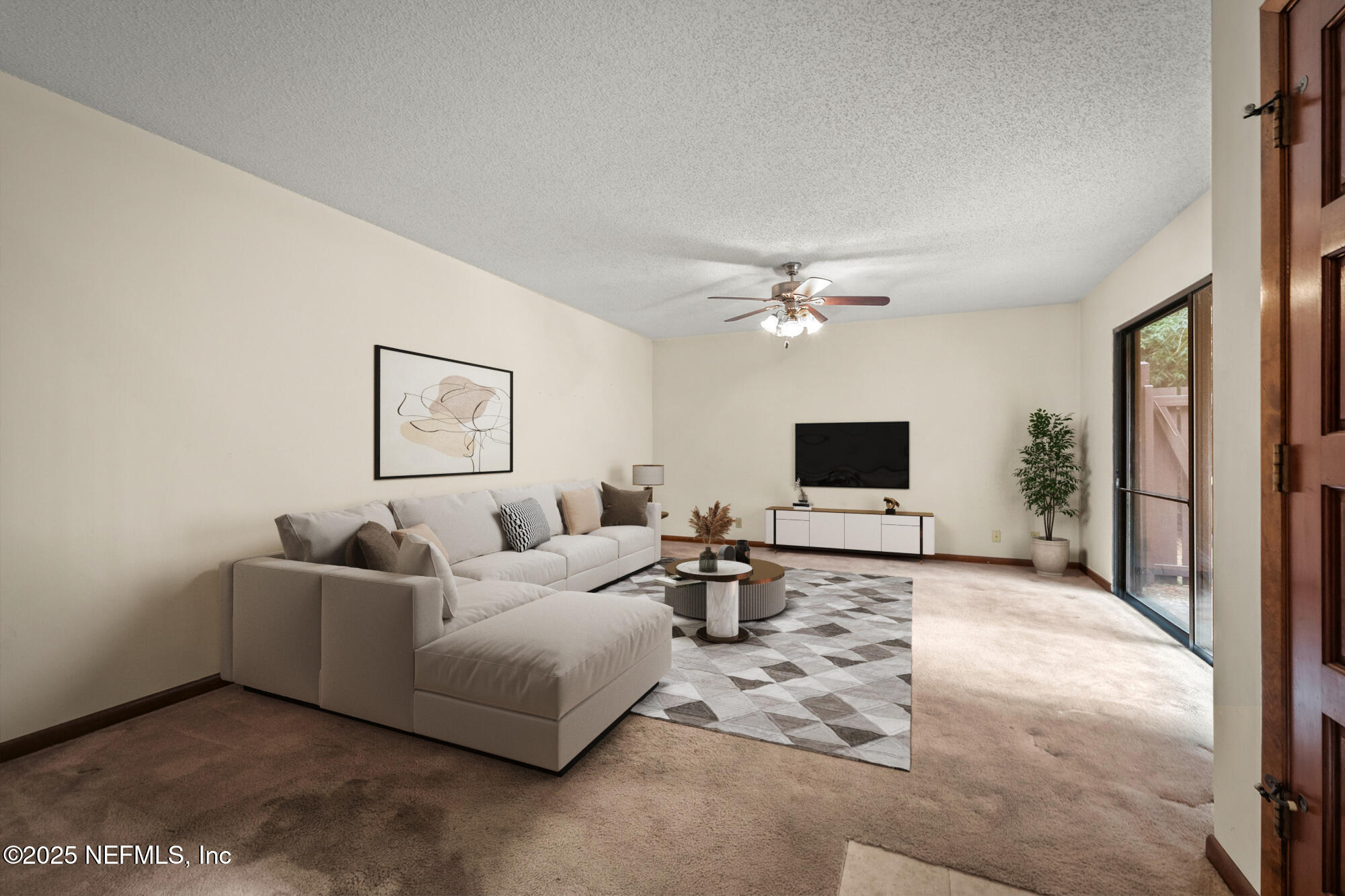 10349 Big Tree Terrace Jacksonville, FL 32257 - Photo 11 of 35 a living room with furniture and a flat screen tv