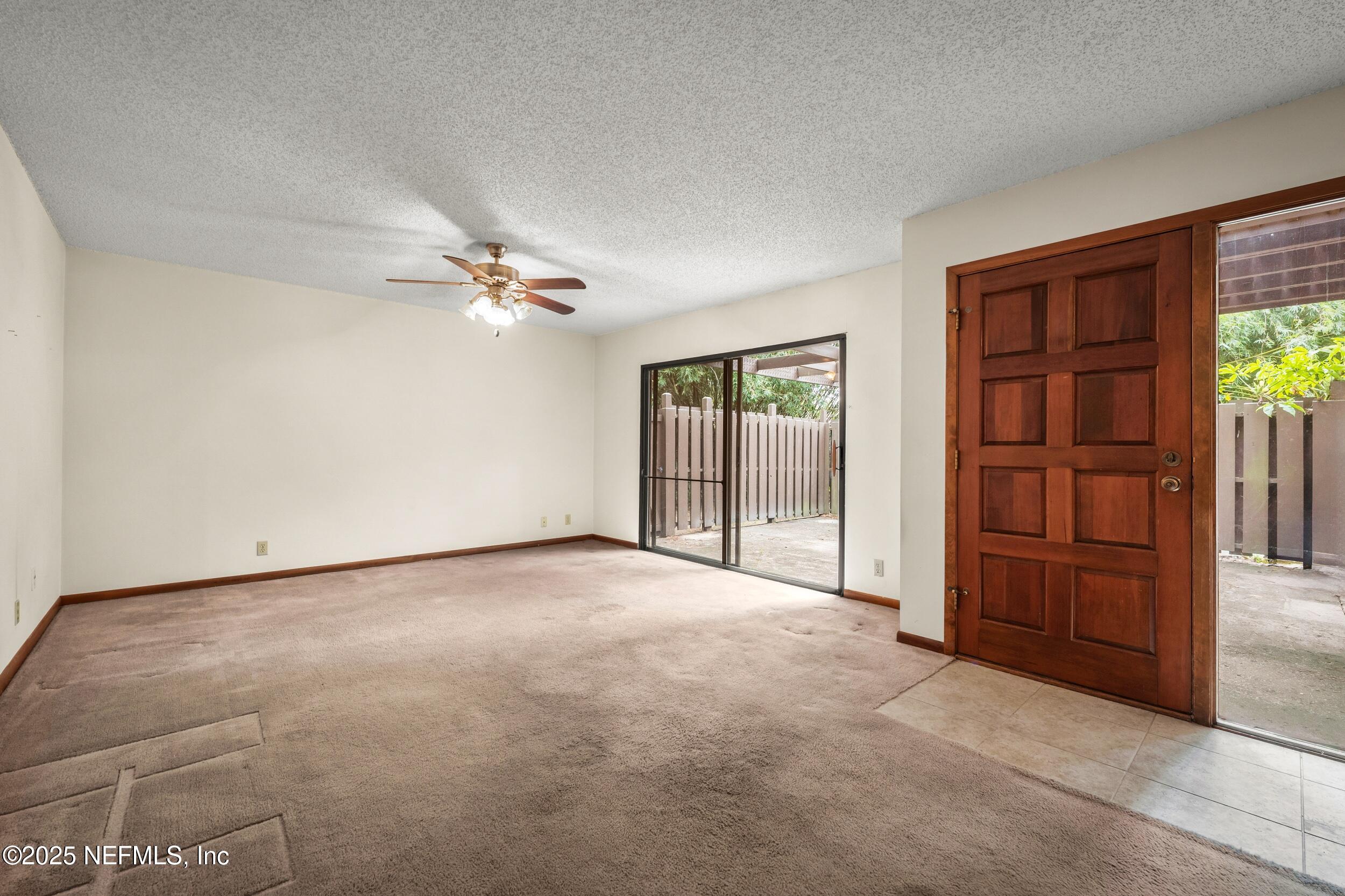 10349 Big Tree Terrace Jacksonville, FL 32257 - Photo 12 of 35 a view of a livingroom with a flat screen tv