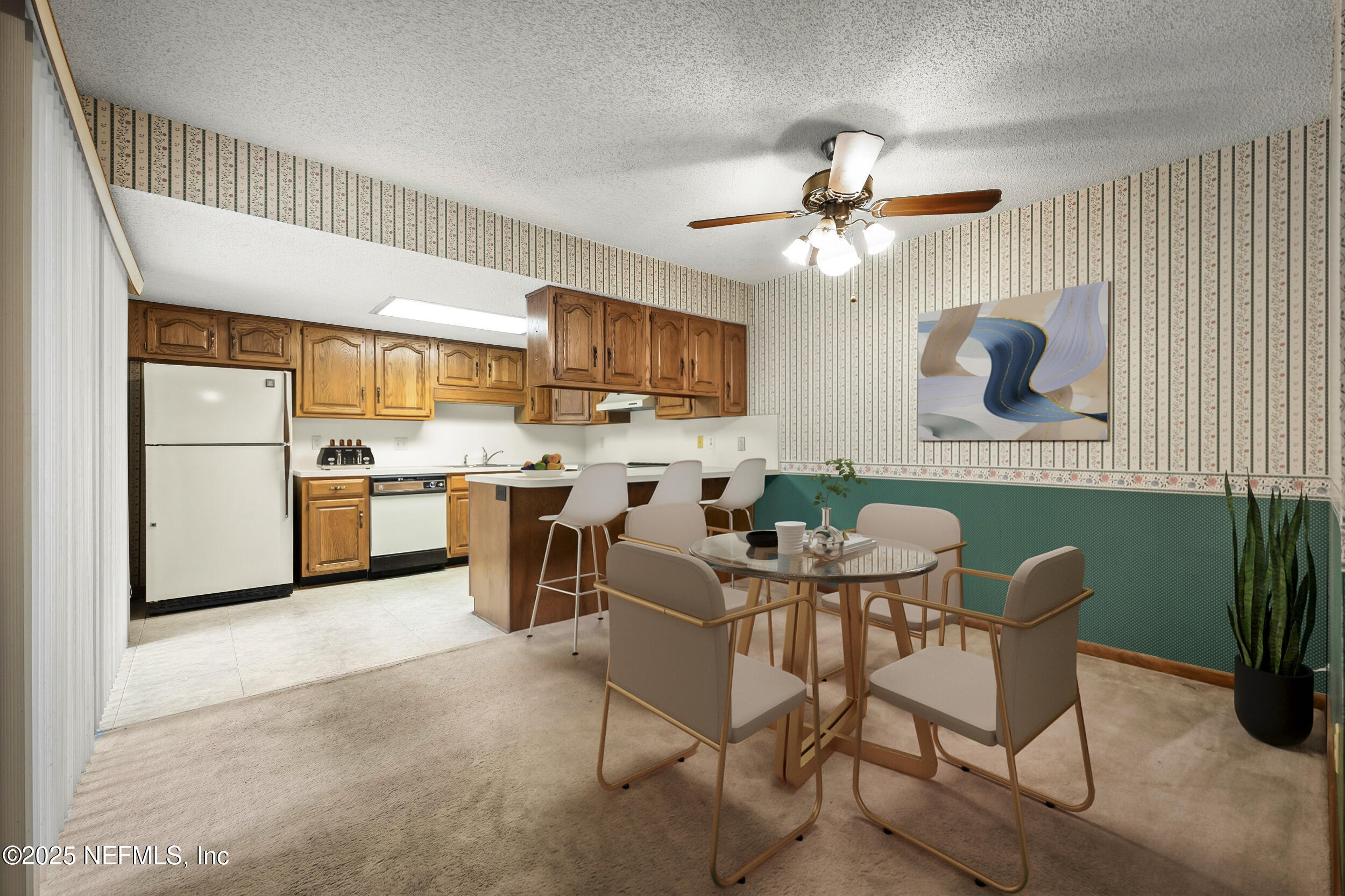 10349 Big Tree Terrace Jacksonville, FL 32257 - Photo 18 of 35 a kitchen with stainless steel appliances kitchen island granite countertop a refrigerator a stove a sink dishwasher and white cabinets with wooden floor