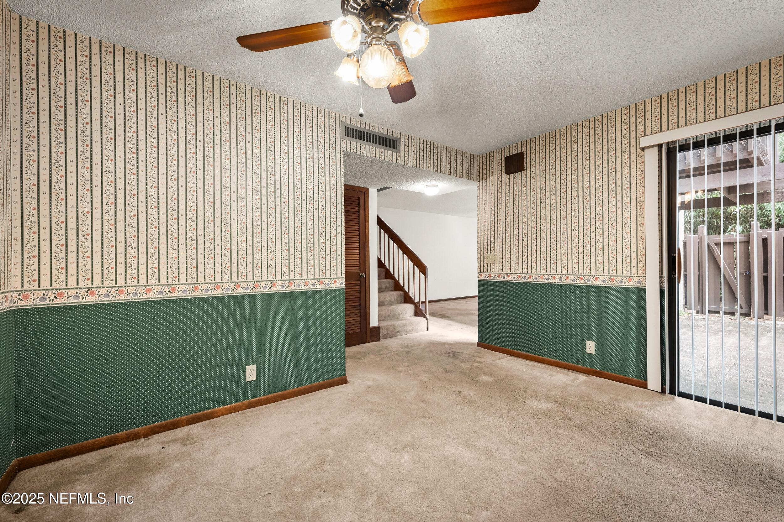 10349 Big Tree Terrace Jacksonville, FL 32257 - Photo 20 of 35 a view of an empty room with a window and stairs