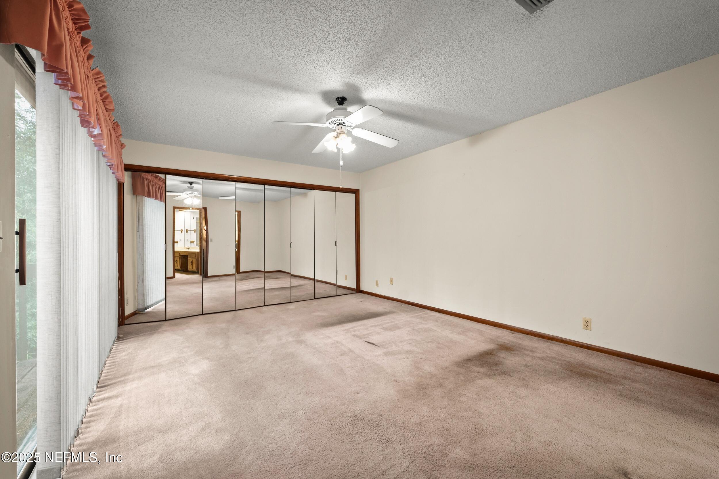 10349 Big Tree Terrace Jacksonville, FL 32257 - Photo 27 of 35 a view of an empty room with a window