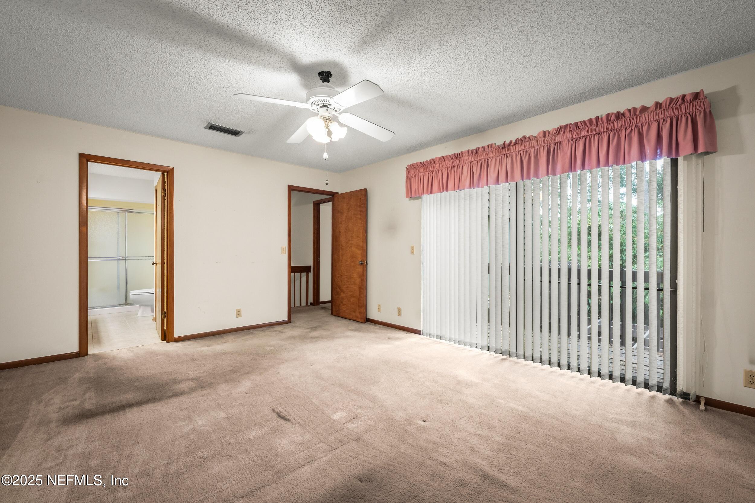 10349 Big Tree Terrace Jacksonville, FL 32257 - Photo 29 of 35 an empty room with fan and windows