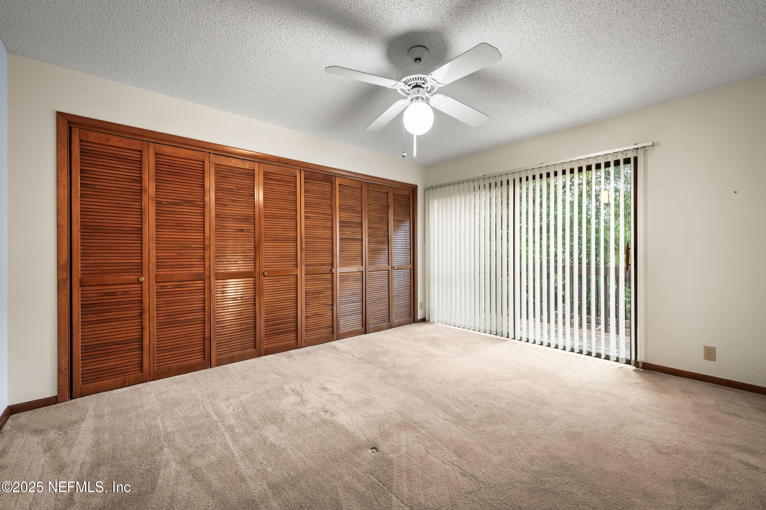 10349 Big Tree Terrace Jacksonville, FL 32257 - Photo 31 of 35 a view of a livingroom with a ceiling fan