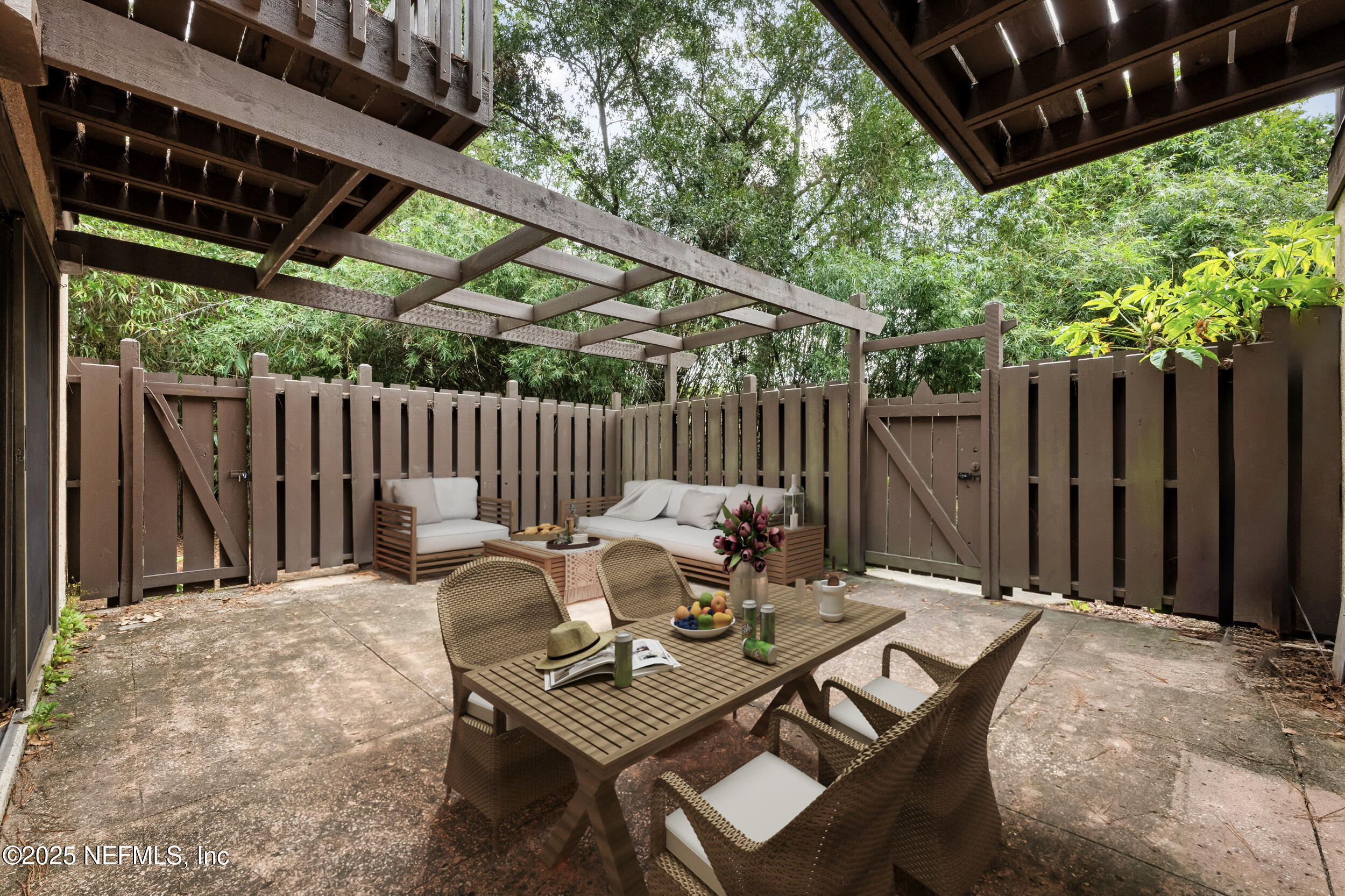 10349 Big Tree Terrace Jacksonville, FL 32257 - Photo 7 of 35 a view of backyard with a table and chairs