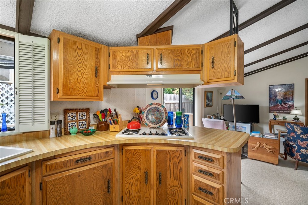 132 Quail Way Avila Beach, CA 93424 - Photo 11 of 38 a kitchen with stainless steel appliances granite countertop a sink and cabinets