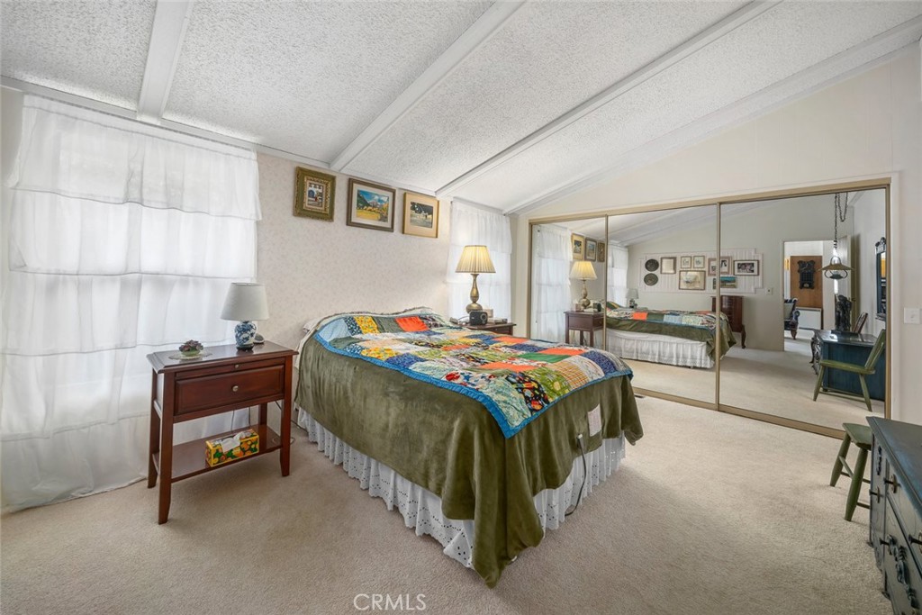 132 Quail Way Avila Beach, CA 93424 - Photo 16 of 38 a bedroom with a bed and a table