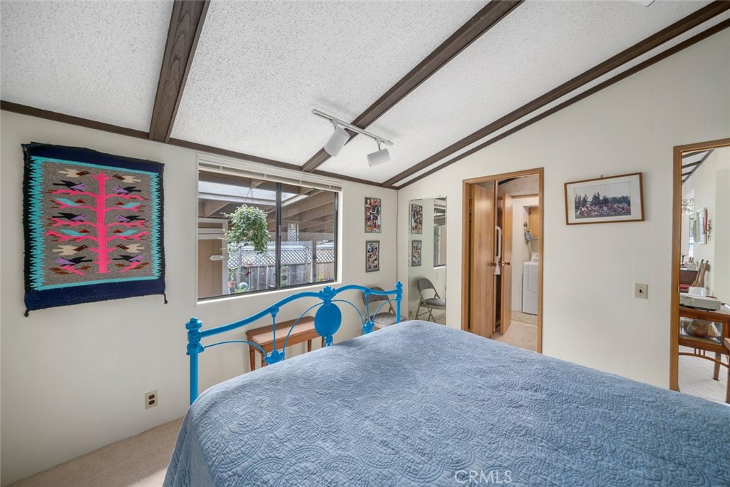 132 Quail Way Avila Beach, CA 93424 - Photo 21 of 38 a bedroom with a bed and a large window