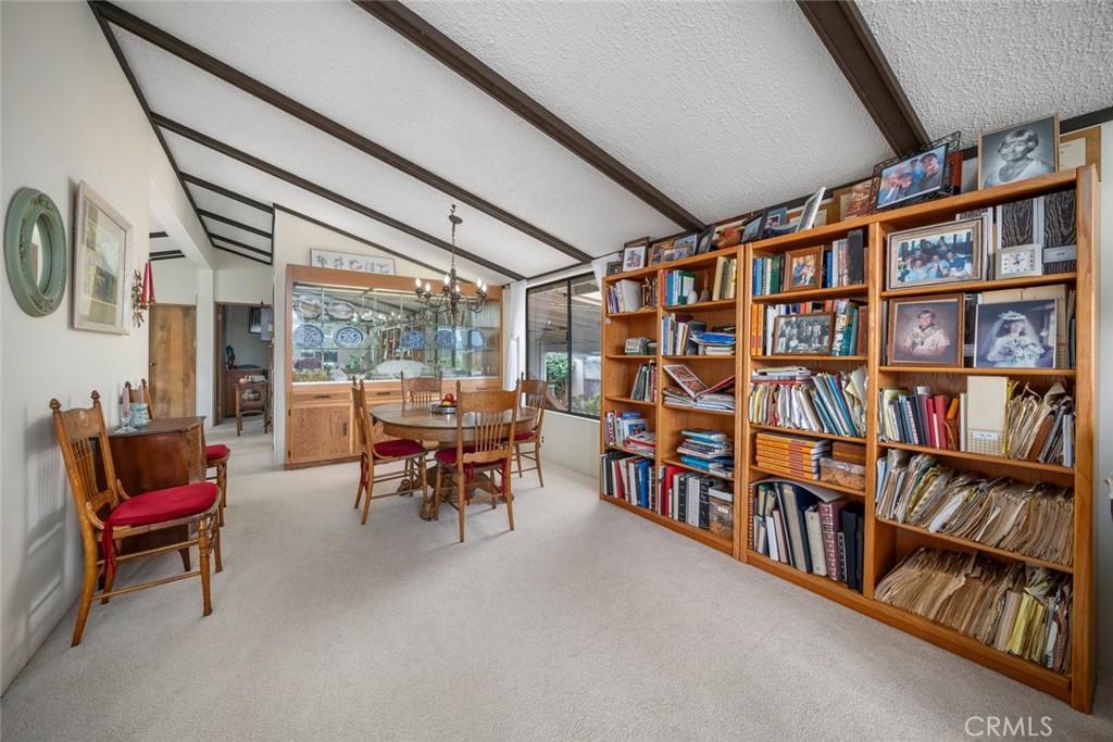 132 Quail Way Avila Beach, CA 93424 - Photo 8 of 38 a living room with lots of furniture and a book shelf