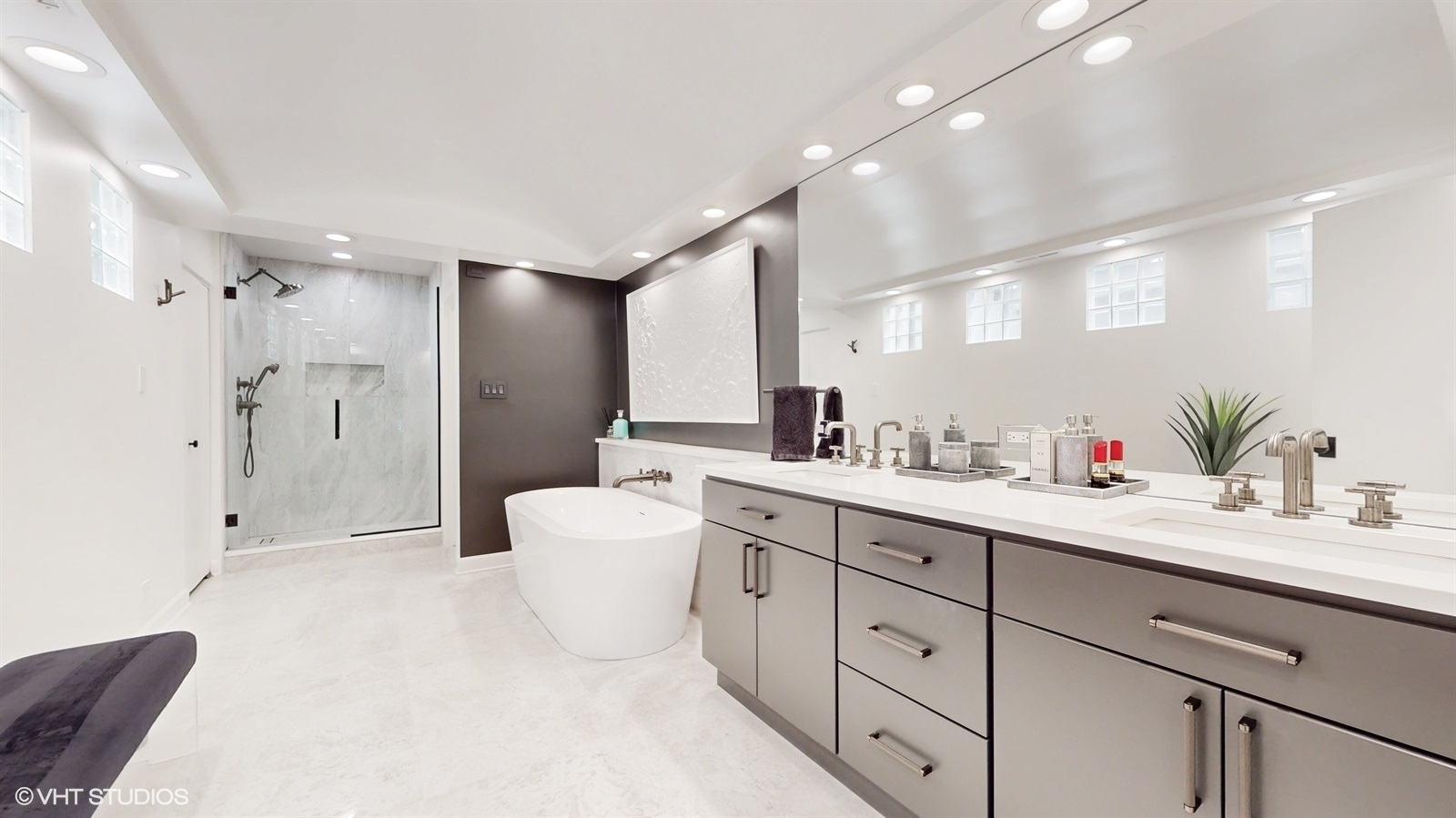 2216 North Wayne Avenue Chicago, IL 60614 - Photo 17 of 40 a spacious bathroom with a double vanity sink mirror and shower