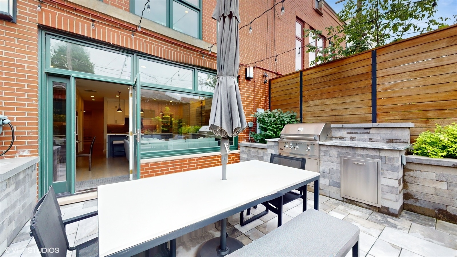 2216 North Wayne Avenue Chicago, IL 60614 - Photo 30 of 40 a view of a patio with table and chairs and potted plants