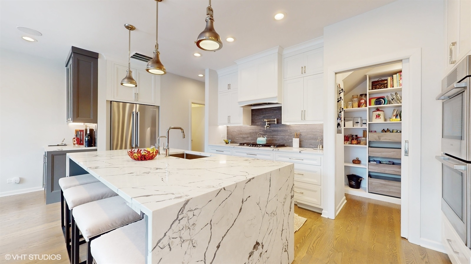 2216 North Wayne Avenue Chicago, IL 60614 - Photo 10 of 40 a kitchen with a refrigerator a sink and a stove