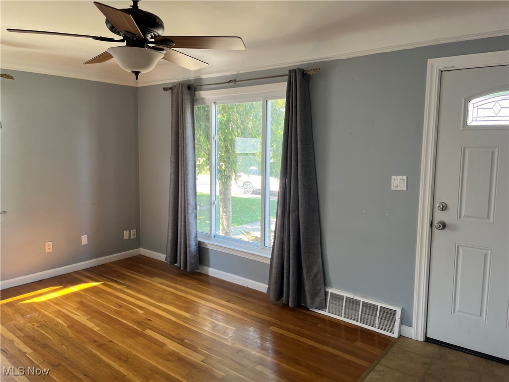 29946 Enid Road Wickliffe, OH 44092 - Photo 14 of 50 Living room with a healthy amount of sunlight, ceiling fan, and hardwood floors