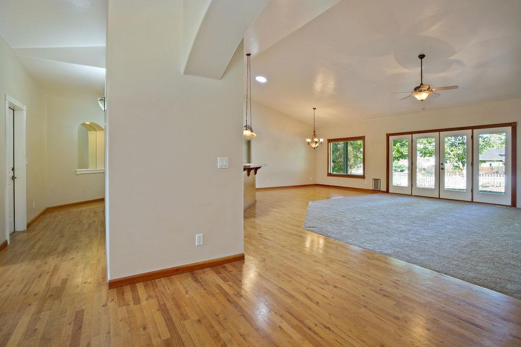 914 Ridgeview Drive Eagle Point, OR 97524 - Photo 12 of 34 a view of an empty room with window and wooden floor