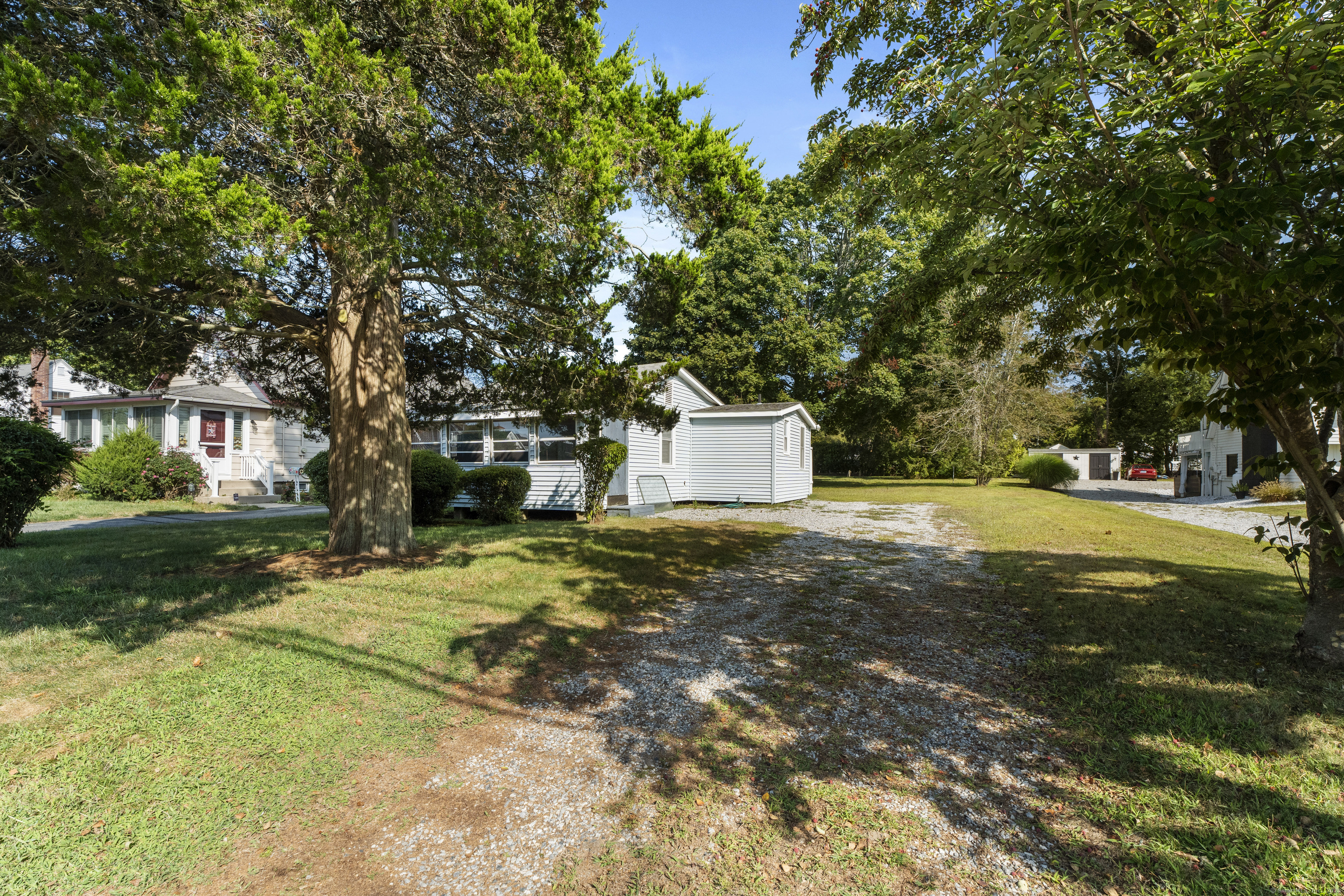 13 College Street Old Saybrook, CT 06475 - Photo 12 of 23 a outdoor view swimming pool and trees