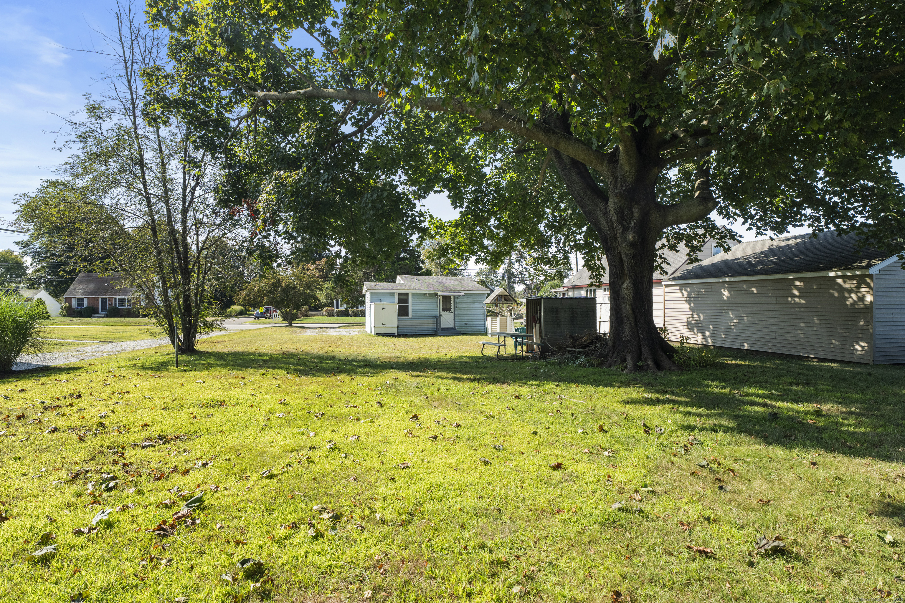 13 College Street Old Saybrook, CT 06475 - Photo 14 of 23 a house with trees in front of it