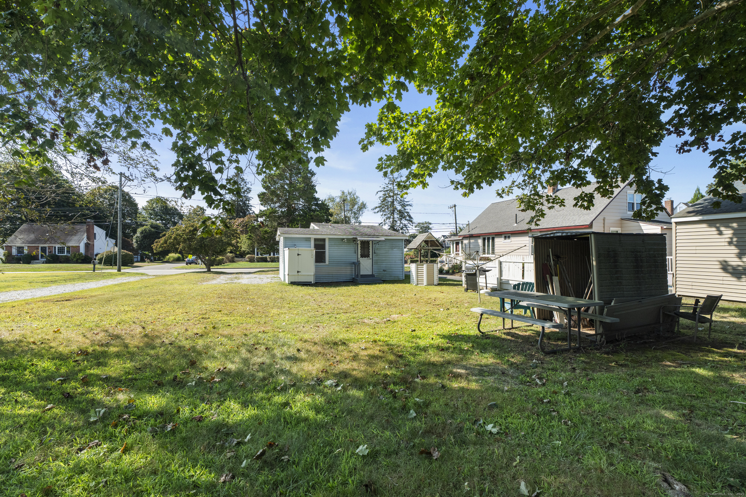 13 College Street Old Saybrook, CT 06475 - Photo 15 of 23 a swimming pool with outdoor seating and yard