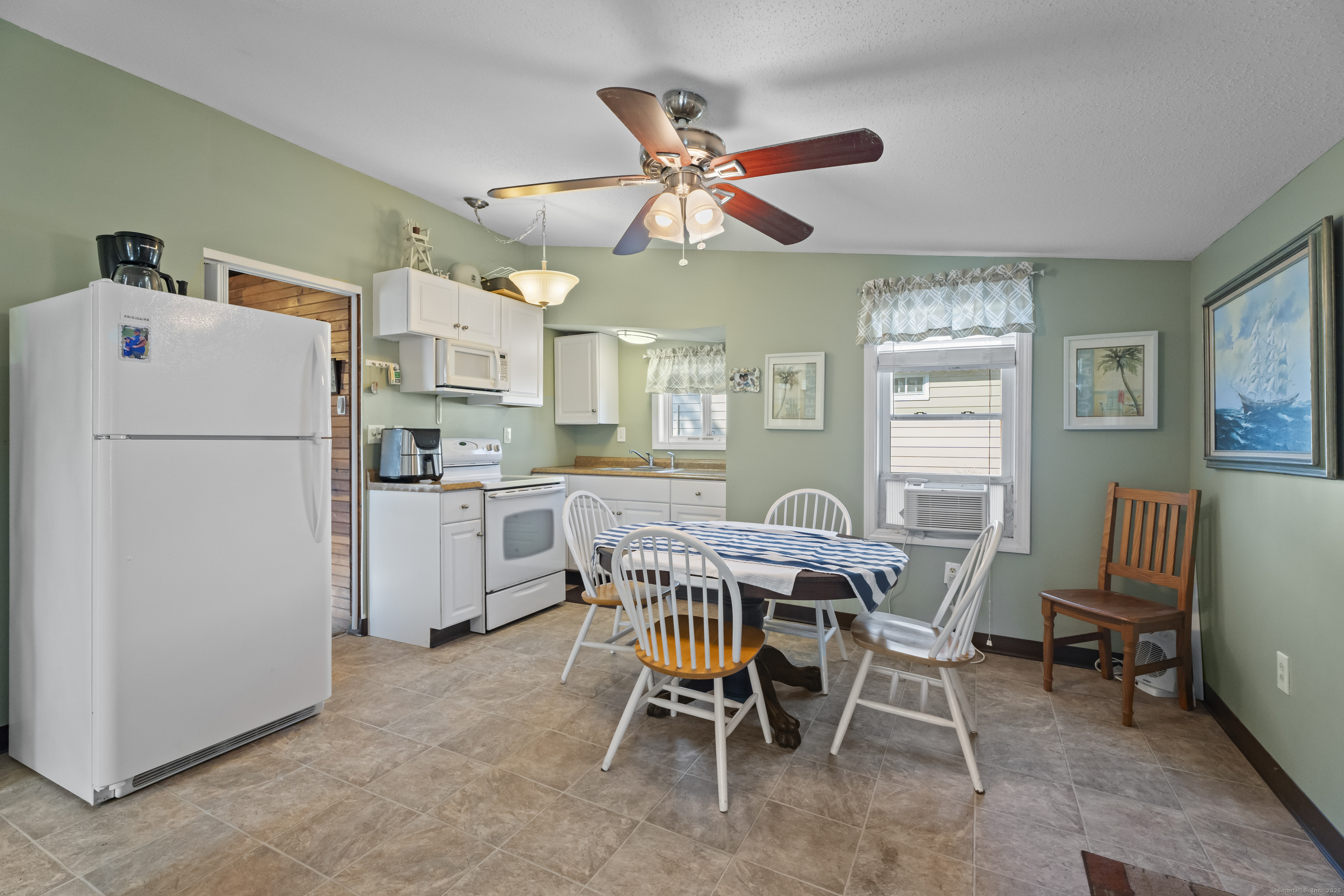 13 College Street Old Saybrook, CT 06475 - Photo 3 of 23 a dining room with furniture and window